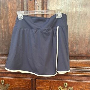 Women's navy skort with white trim. So cute